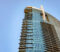 Glass skyscraper against blue sky, view from the bottom